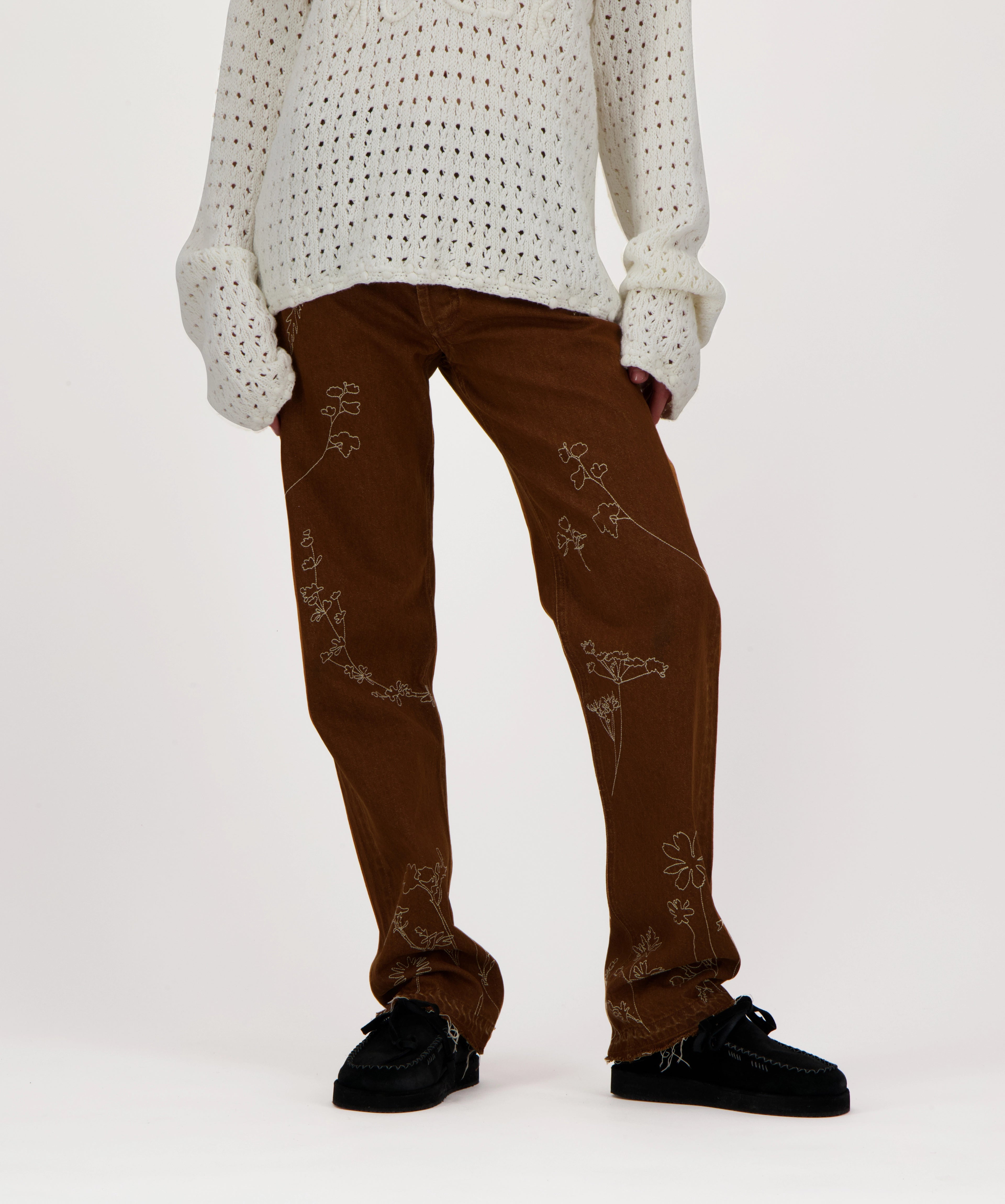Washed effect jeans with floral embroidery