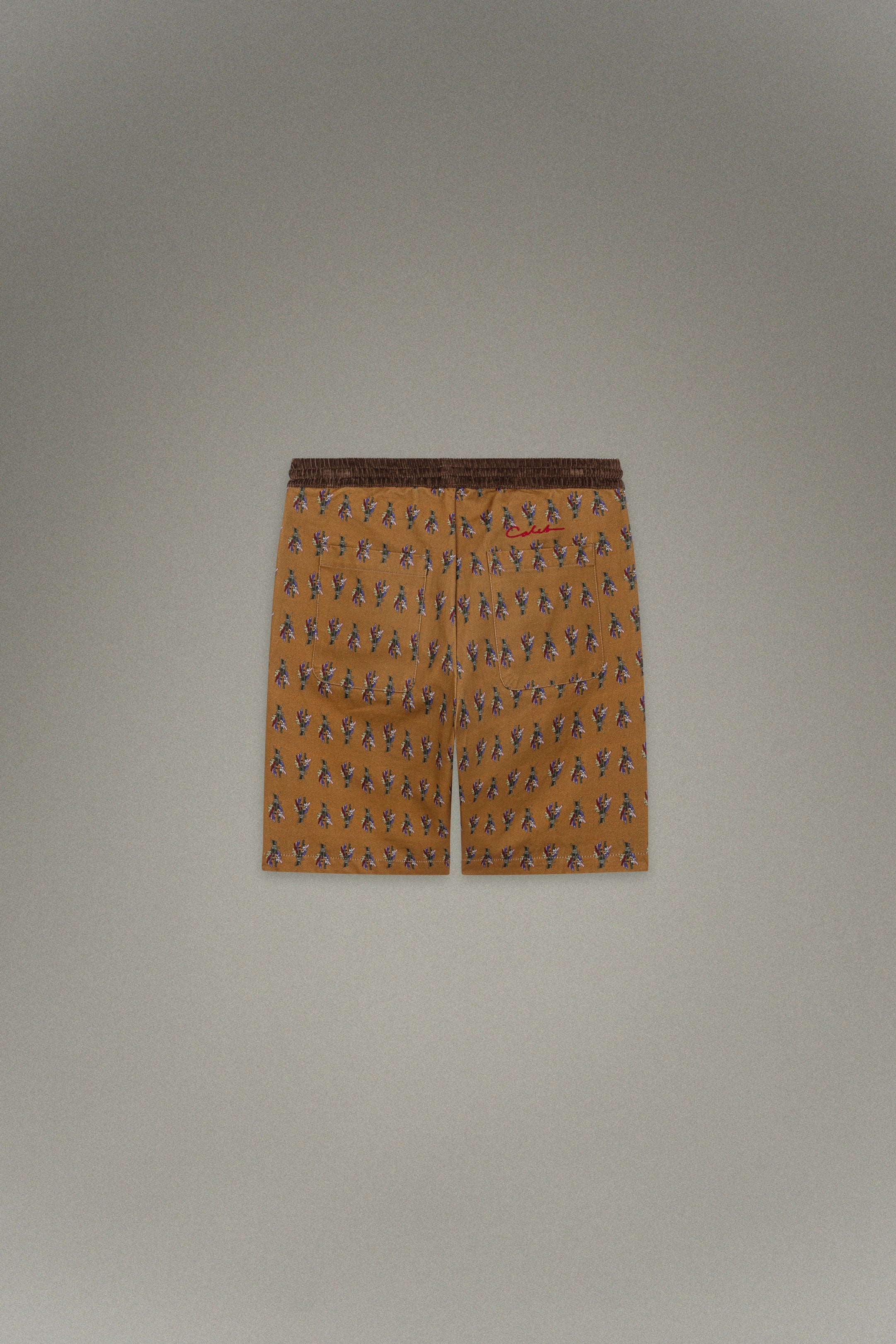 Short marron à motif floral